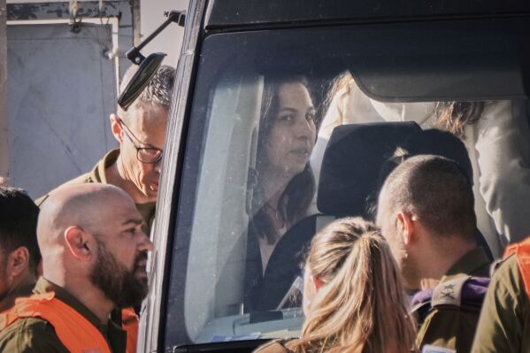 Israeli soldier Karina Ariev, who was kidnapped in Gaza by Hamas on Oct. 7, gets on a bus after landing in a helicopter together with three other Israeli female soldiers released by Hamas, on the helipad of the Beilinson hospital in Petah Tikva, near Tel Aviv, Israel, Saturday, Jan. 25, 2025. (Photo/Leo Correa)